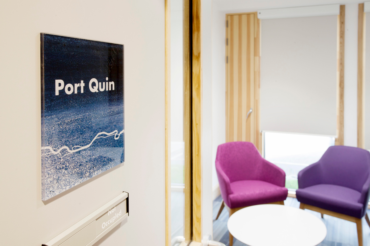 This door sign featuring detail from Kurt Jackson paintings was overlaid with text showing the name of a Cornish cove and Chelsea Holter's graphic motif