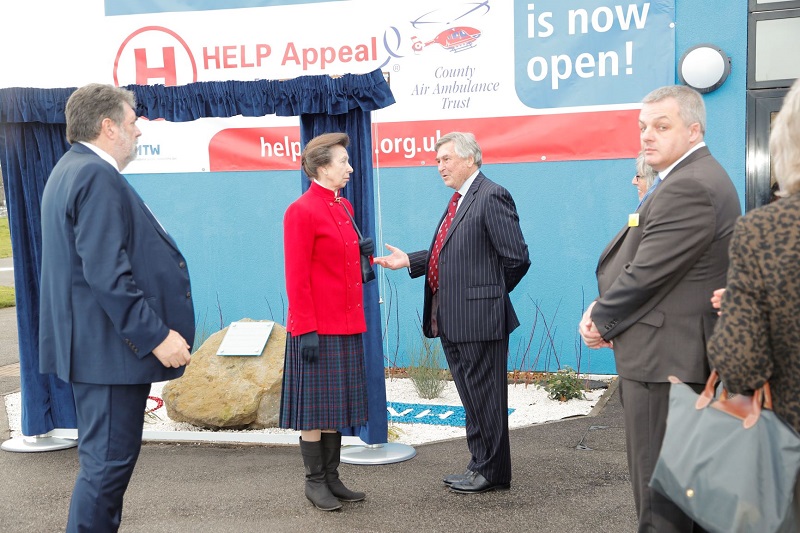 Keith White from the HELP Appeal speaks to Princess Anne about the impact the helipad will have on patients