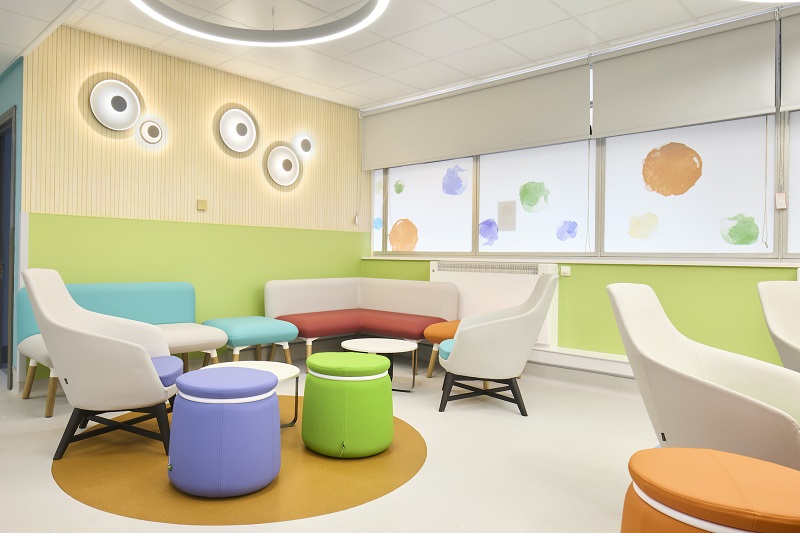 Wall protection solutions incorporating art can provide resilience and protection for buildings as well as providing a less-clinical environment for patients and staff
